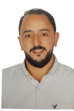 Smiling man with short dark hair and beard, wearing a white collared shirt.